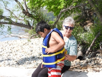 Mom and daughter in Lake Michigan with lifejacket loaners