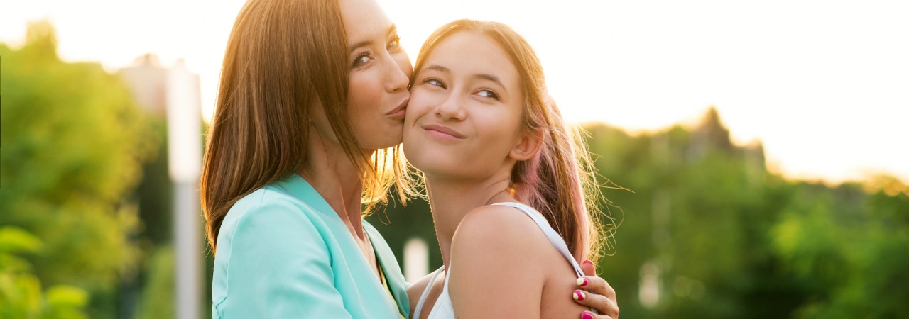 Photo of a teenager and her mom.