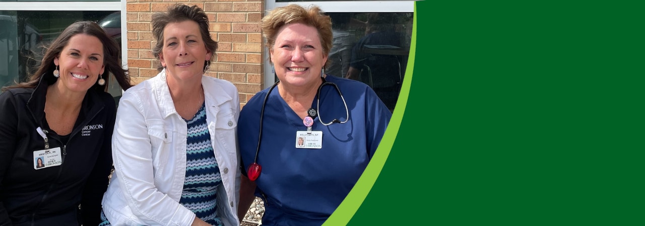 Photo of Michelle, a breast cancer patient at Bronson Cancer Center in Kalamazoo, along with her team of nurses.