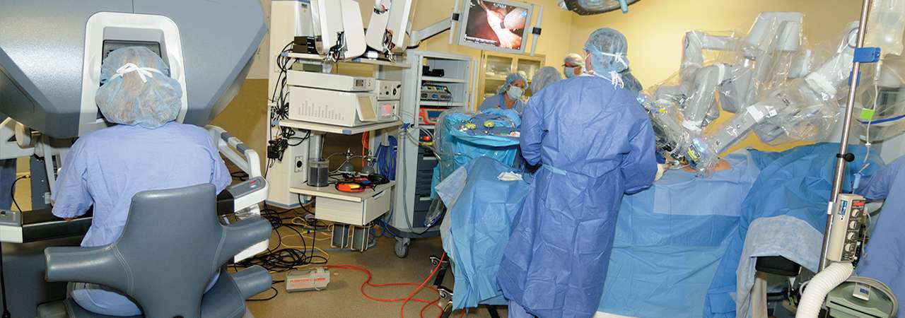 Image of doctors performing robotic surgery.