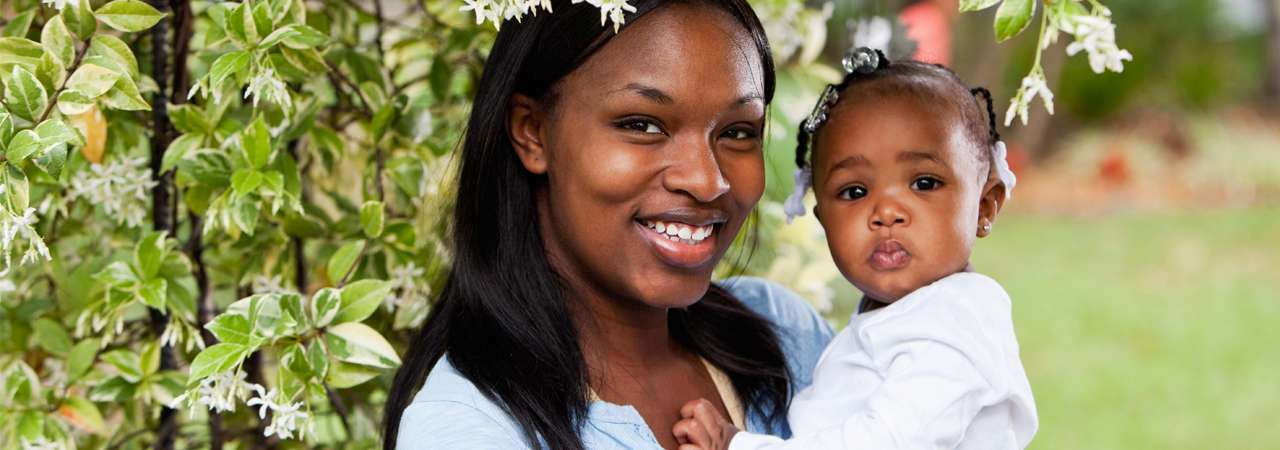 Photo of a mother and daughter at a park.