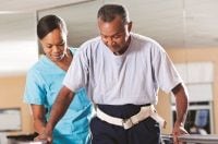 Bronson physical therapist helping patient during a rehabilitation session.