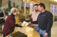 Staff member greeting guests at Bronson location.