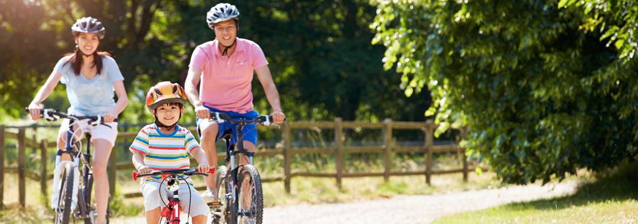 Image of family riding their bikes.