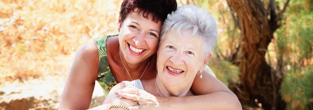 Photo of senior-aged woman and her daughter.