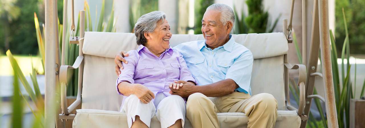 Man and woman sitting on a bench.