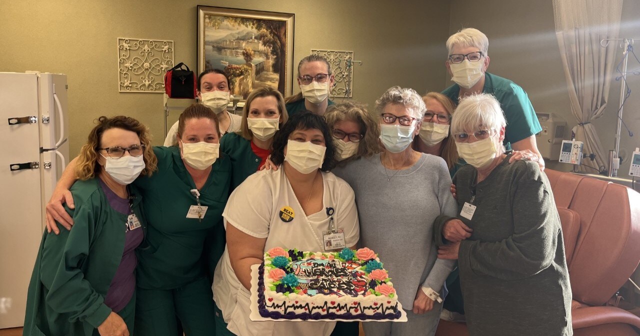 Photo of Bronson Cancer Center nurses smiling with long-term patient, Beverly