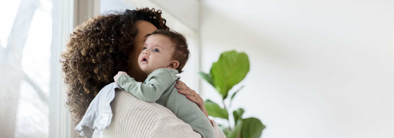 Photo of a mom with her baby at home.