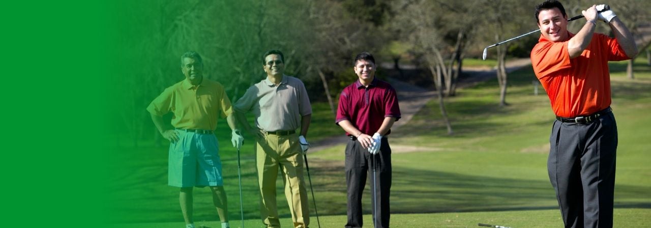 A group of men playing golf together.