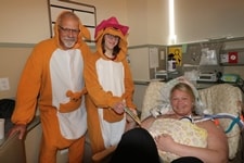 Dr. Seth Malin and NICU Graduate dressed as kangaroos, with Patient and Baby