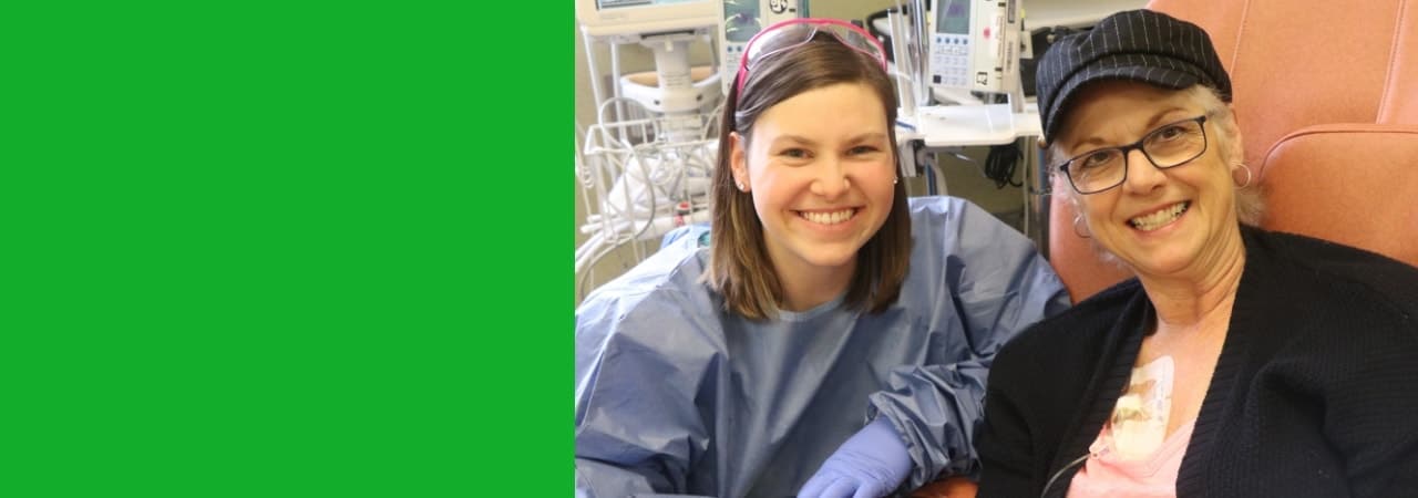 Image of a patient and her nurse smiling for the camera