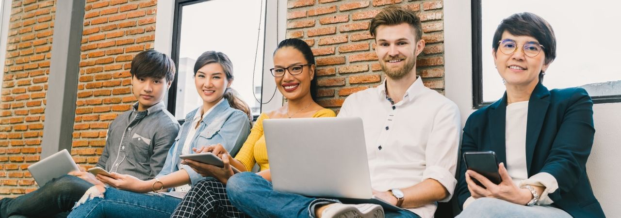 Photo of adults with computers