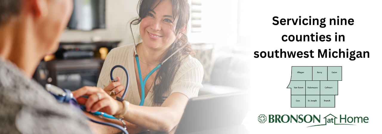 Home health nurse checking on a patient in their home.