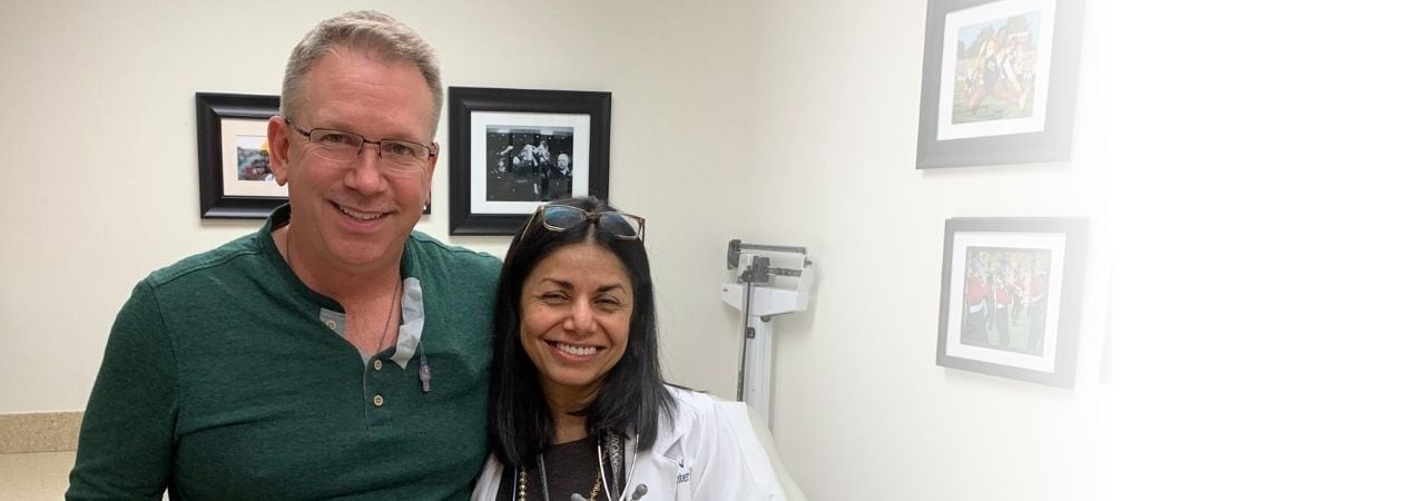 Photo of Brian Roy, cancer care center patient, along with his oncologist, Dr. Bhagwati.