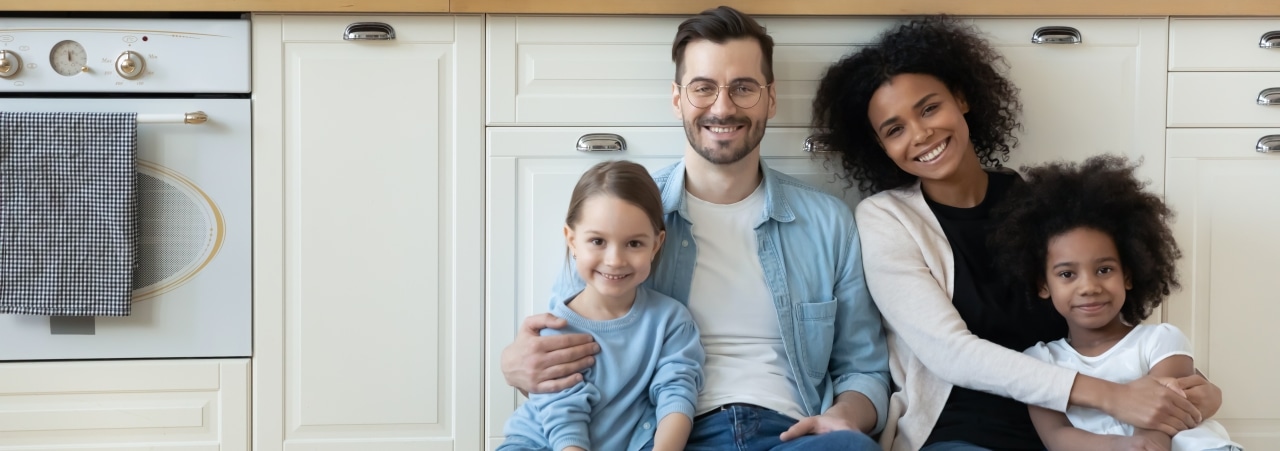 Smiling Family in Kitchen