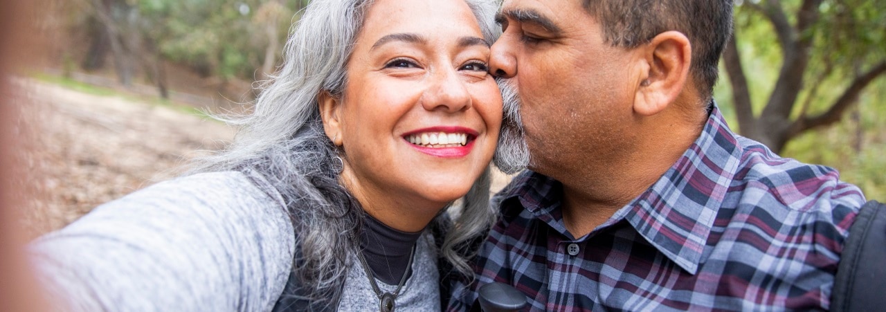 Photo of a active adult couple outside.