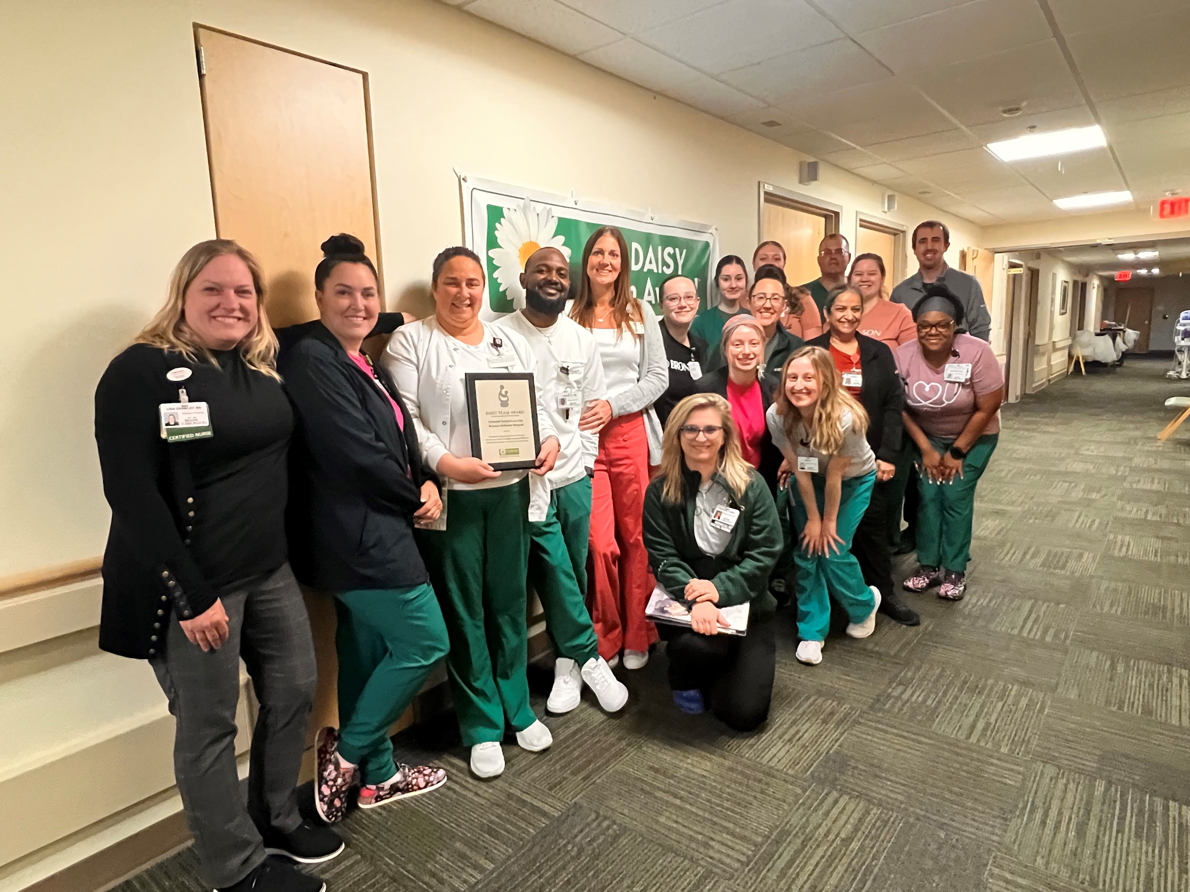 Photo of the extended medical unit team at Bronson Methodist Hospital smiling together on the unit.