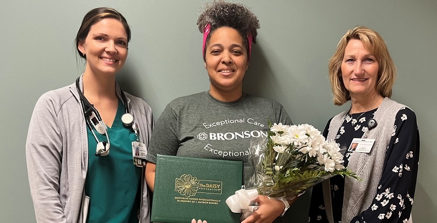 Arial, a nurse at Bronson LakeView Hospital smiles for the camera as she receives the DAISY Award for Extraordinary nurses.