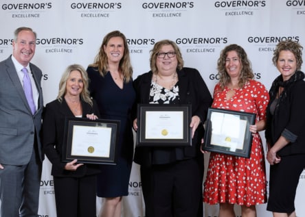 Bronson leaders accept the Governor's Award of Excellence.