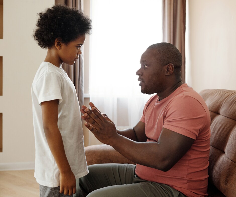 Image of father talking to son