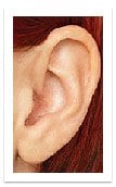 Photo of ear with hearing aid completely in the canal.