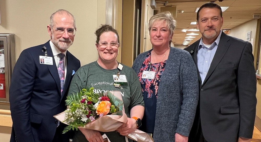 Bronson Battle Creek nurse, Amber, smiles along with her leadership team as she receives the 2024 BEE Award for Licensed Practical Nurses.